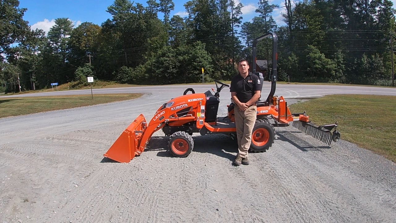Kubota BX23 Compact Tractor Repairing the Driveway with a Box Blade and Landscape Rake