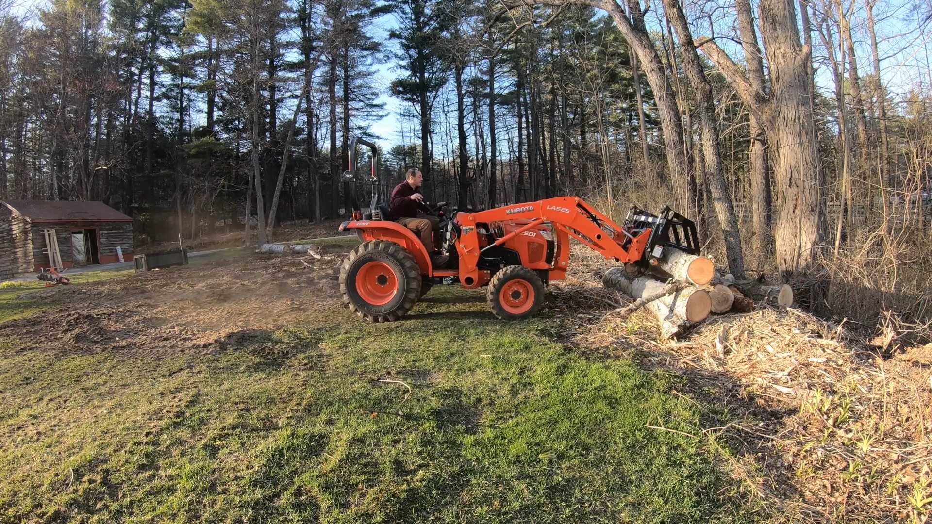 Kubota L2501 Compact Tractor Using a Grapple and Chipper to Remove and Clean Up Brush